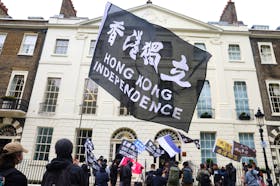 People demonstrate outside the Hong Kong Economic and Trade Office in London, in support of the arrest of three men later charged with assisting Hong Kong's foreign intelligence service in Britain. Picture taken on May 14, 2024.