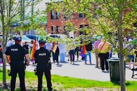 People gathered at Citizen’s Square Park in Woodstock on Friday, May 17 to listen to speakers on the International Day Against Homophobia, Transphobia, and Biphobia.