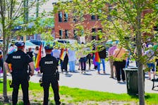 People gathered at Citizen’s Square Park in Woodstock on Friday, May 17 to listen to speakers on the International Day Against Homophobia, Transphobia, and Biphobia.