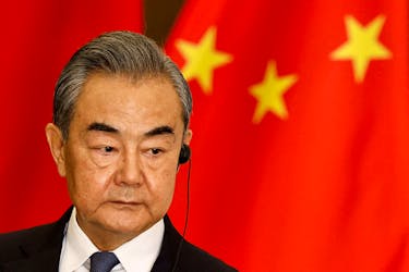Chinese Foreign Minister Wang Yi listens during a joint press conference in Jakarta, Indonesia, April 18, 2024.