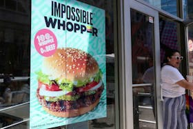 A sign advertising the soy based Impossible Whopper is seen outside a Burger K/File Photoing in New York, U.S., August 8, 2019.