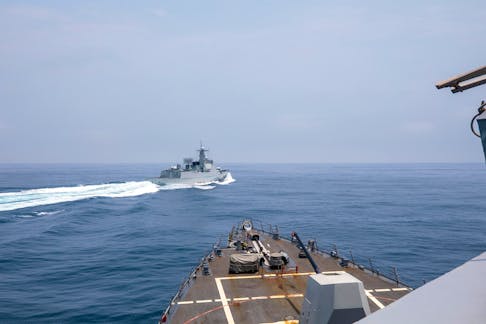 Chinese warship Luyang III sails near the U.S. destroyer USS Chung-Hoon, as seen from the deck of U.S. destroyer, in the Taiwan Strait, June 3, 2023, in this handout picture. U.S. Navy/Mass Communication Specialist 1st Class Andre T. Richard/Handout via