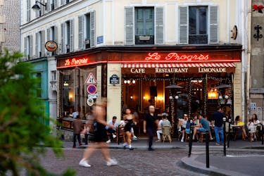 People walk past a restaurant at the Butte Montmartre in Paris, France, July 10, 2023.