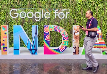 A man walks past the sign of "Google for India", the company's annual technology event in New Delhi, India, September 19, 2019.