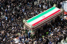 Mourners attend the funeral for victims of helicopter crash that killed Iran's President Ebrahim Raisi, Foreign Minister Hossein Amirabdollahian and others, in Tehran, Iran, May 22, 2024. Majid Asgaripour/WANA (West Asia News Agency) via