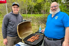A park warming event was held at the site of the future Falmouth Family Park, 369 Town Rd., on May 18. Pictured is Matt Dunfield, left, who first proposed the project in 2022, and Paul Burgess, the president of the Windsor and District Lions Club. Visitors to the site had a chance to learn about what’s planned for the property while enjoying a free barbecue and refreshments.
