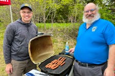 A park warming event was held at the site of the future Falmouth Family Park, 369 Town Rd., on May 18. Pictured is Matt Dunfield, left, who first proposed the project in 2022, and Paul Burgess, the president of the Windsor and District Lions Club. Visitors to the site had a chance to learn about what’s planned for the property while enjoying a free barbecue and refreshments.