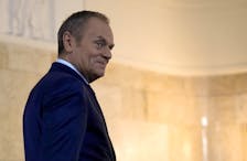 Polish Prime Minister Donald Tusk walks to meet British Prime Minister Rishi Sunak at the Chancellery of the Prime Minister in Warsaw, Poland, April, 23, 2024.