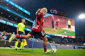 May 18, 2024; Queens, New York, USA; New York Red Bulls defender John Tolkin (47) inserts a corner during the first half against New York City FC  at Citi Field. Mandatory Credit: Vincent Carchietta-USA TODAY Sports