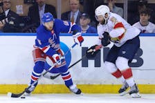May 22, 2024; New York, New York, USA; New York Rangers left wing Artemi Panarin (10) controls the puck against Florida Panthers defenseman Aaron Ekblad (5) during the third period of game one of the Eastern Conference Final of the 2024 Stanley Cup Playoffs at Madison Square Garden. Mandatory Credit: Brad Penner-USA TODAY Sports