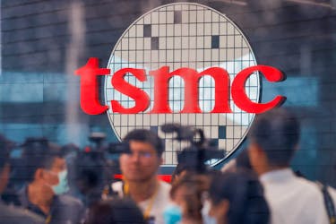 Taiwan Semiconductor Manufacturing Company's (TSMC) logo is seen while people attend the opening of the TSMC global R&D center in Hsinchu, Taiwan July 28, 2023.