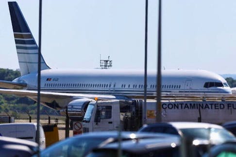 A plane reported by British media to be first to transport migrants to Rwanda is seen on the tarmac at MOD Boscombe Down base in Wiltshire, Britain, June 14, 2022.
