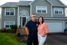 Terry and Michele Davidson pose for a photo in front of their home in the Westwood Hills subdivision on Thursday, May 23, 2024. Terry is a volunteer firefighter and spent many long days battling last year's wildfire.
Ryan Taplin - The Chronicle Herald