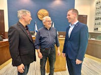 Yarmouth Town Councillor Wade Cleveland, Argyle Municipal Warden Danny Muise, and Service Nova Scotia Minister Colton LeBlanc discuss matters following an announcement of funding to enhance water and wastewater infrastructure. TINA COMEAU
