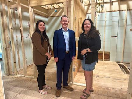 YACRO program directors Aimee Acker and Ginger Gates stand with Service Nova Scotia Minister Colton LeBlanc in an area of the YACRO Community Hub on Queen Street in Yarmouth that is undergoing renovations to make the washrooms accessible. TINA COMEAU