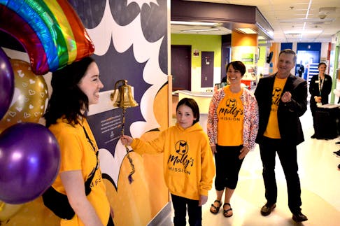 The family Wadden family were all smiles Friday in unveiling a special bell that now hangs in the pediatric unit at the Cape Breton Regional Hospital. The bell is honour of Wadden family member Molly who died in 2022 at the age of 12 after battling bone cancer. The bell is meant to be rung to mark special milestones in the lives of critical ill children such as the completion of treatment. From left, Larissa Wadden, 18, Chase Wadden, nine, Nadine Keeler-Wadden and Jeff Wadden. Cape Breton Post Staff
