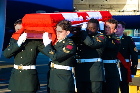 The remains of the unknown soldier arrived at St. John's International Airport Saturday evening were driven through the capital city past several points of historical significance. Keith Gosse/The Telegram