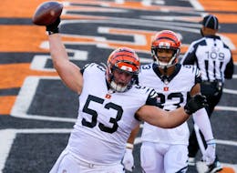 Nov 1, 2020; Cincinnati, Ohio, USA; Cincinnati Bengals center Billy Price (53) spikes the football after a touchdown by running back Giovani Bernard (not pictured) against the Tennessee Titans during the fourth quarter at Paul Brown Stadium.  Mandatory Credit: Joseph Maiorana-USA TODAY Sports/File Photo