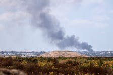 Smoke rises following an airstrike in Gaza, amid the ongoing conflict between Israel and the Palestinian Islamist group Hamas, near the Israel-Gaza border, as seen from Israel, May 25, 2024.REUTERS/Thomas Suen