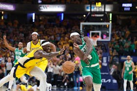 May 25, 2024; Indianapolis, Indiana, USA; Boston Celtics guard Jrue Holiday (4) chases a loose ball against Indiana Pacers forward Pascal Siakam (43) with 1.8 seconds left in game three of the eastern conference finals in the 2024 NBA playoffs at Gainbridge Fieldhouse. Mandatory Credit: Trevor Ruszkowski-USA TODAY Sports