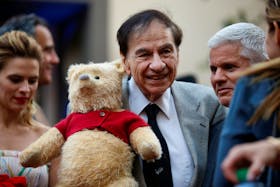 Songwriter Richard M. Sherman holds a stuffed Winnie the Pooh as he poses at the world premiere of Disney's "Christopher Robin," in Burbank, California, U.S., July 30, 2018.