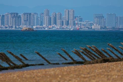 Anti-landing barricades are pictured on the beach, with China's Xiamen city in the background, in Kinmen, Taiwan, Feb. 21, 2024.