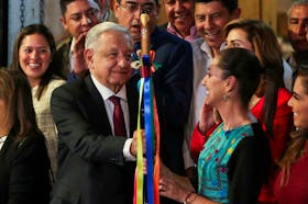 Mexico's President Andres Manuel Lopez Obrador hands over a ceremonial baton of command to Claudia Sheinbaum after she was elected by the ruling National Regeneration Movement (MORENA) as its candidate to succeed him in 2024 in the presidential election, in Mexico City, Mexico September 7, 2023.