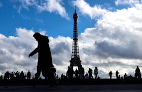 People take in views of the Eiffel Tower from the Trocadero, Paris, France October 29, 2023. 