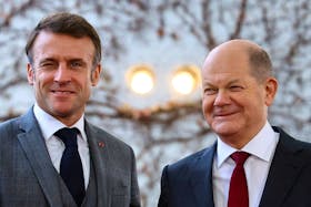 German Chancellor Olaf Scholz poses with French President Emmanuel Macron, during the "Compact with Africa" investment summit, at the Chancellery in Berlin, Germany, November 20, 2023.
