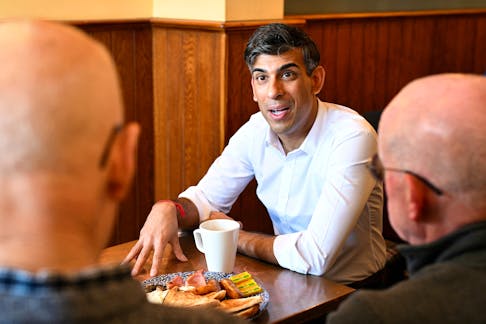 British Prime Minister and Conservative Party leader Rishi Sunak meets with veterans at a community breakfast in North Yorkshire, Britain, on May 25, 2024, during a party campaign event in the build-up to the UK general election on July 4. OLI SCARFF/Pool via REUTERS
