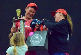 Suzy Atwood presents the championship trophy for the Great Lobsterman Challenge to Corey Crowell, who claimed his fifth title at the 2022 Shelburne County Lobster Festival. Crowell will be back to defend his title this year.  KATHY JOHNSON