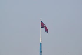 A North Korean flag flutters on top of the 160-metre tall tower at North Korea's propaganda village of Gijungdong, in this picture taken from Tae Sung freedom village near the Military Demarcation Line (MDL), inside the demilitarised zone separating the two Koreas, in Paju, South Korea, September 30, 2019.