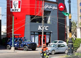 A Federal police vehicle is parked near a KFC fast food restaurant following an attack in Baghdad,Iraq May 27, 2024.