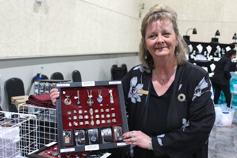 Heather Day holds a collection of jewelry she crafted for her business, Treasures with Heart, at the Port of Sydney on Tuesday. Day, a longtime vendor at the Cape Breton Farmers' Market, said she has thousands of dollars in products and supplies locked away and inaccessible due to a dispute between the market and its landlords. LUKE DYMENT/CAPE BRETON POST