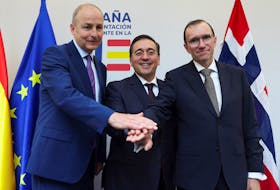 Spanish Foreign Minister Jose Manuel Albares, Norway's Foreign Minister Espen Barth Eide and Ireland's Foreign Minister Micheal Martin gesture after a press conference in Brussels, Belgium May 27, 2024.REUTERS/Johanna Geron