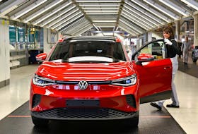 A technician works on the final inspection of an electric Volkswagen ID. 4 car model at the production plant of the Volkswagen Group in Zwickau, Germany, April 26, 2022.