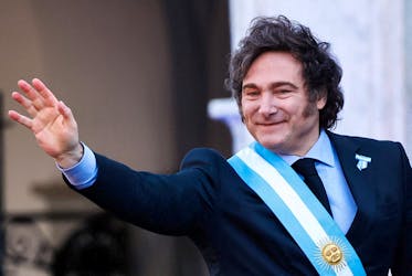 Argentina's President Javier Milei waves to supporters outside the Cabildo during the commemoration of the 214th anniversary of the May Revolution, in Cordoba, Argentina May 25, 2024.