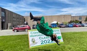 In this Cape Breton Post file photo, C.J. de Loyola celebrates his graduation from Memorial High School with a backflip after June ceremony at the Sydney Mines school. The 2021-22 school year wraps up Thursday with "grading day." De Loyola, who lives in Sydney, graduated from Memorial's electrical program. CONTRIBUTED