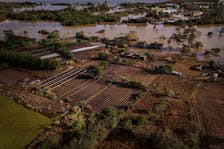 A drone view shows the flooded plantations, houses and streets of the Integracao Gaucha settlement in Eldorado do Sul, Rio Grande do Sul state, Brazil, May 17, 2024. Record-breaking floods in southern Brazil, the result of weather patterns intensified by climate change, have only started to recede after displacing half a million people in the state of Rio Grande do Sul and killing more than 160.     