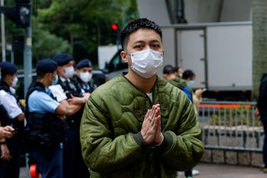 Lee Yue-shun, one of the 47 pro-democracy activists charged with conspiracy to commit subversion under the national security law, arrives at the West Kowloon Magistrates' Courts building in Hong Kong, China February 6, 2023.