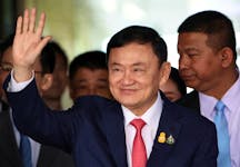 Former Thai Prime Minister Thaksin Shinawatra, who is expected to be arrested upon his return as he ends almost two decades of self-imposed exile, waves at Don Mueang airport in Bangkok, Thailand August 22, 2023.