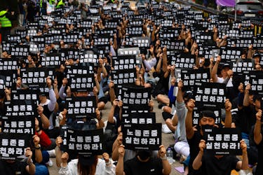 The National Samsung Electronics Union (NSEU) members hold banners that read "Respect labour" in front of the Samsung Electronics Seocho Building in Seoul, South Korea, May 24, 2024.