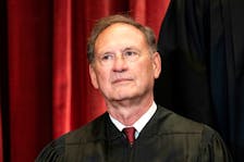 Associate Justice Samuel Alito poses during a group photo of the Justices at the Supreme Court in Washington, U.S., April 23, 2021. Erin Schaff/Pool via