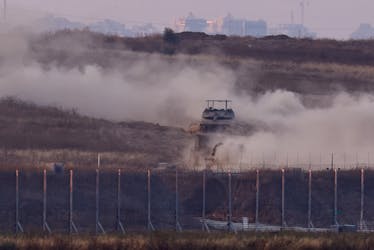 An Israeli tank manoeuvres inside Gaza, amid the ongoing conflict between Israel and the Palestinian Islamist group Hamas, as seen from Israel, May 28, 2024.