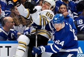 David Kampf (64) of the Toronto Maple Leafs checks David Pastrnak (88) of the Boston Bruins during the second period of Game 6 of the First Round of the 2024 Stanley Cup Playoffs at Scotiabank Arena on Thursday, May 2, 2024, in Toronto. 