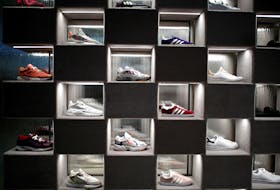File photo: Adidas sneakers are displayed for sale at the Galeries Lafayette department store on the Champs-Elysees avenue in Paris, France, April 11, 2019.