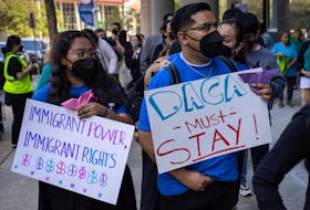 Immigrants and activists hold placards in support of the Deferred Action for Childhood Arrivals (DACA) policy ahead of a hearing on a revised version of the DACA program outside a federal courthouse in Houston, Texas, U.S., June 1, 2023.