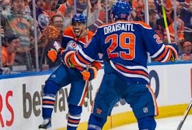 Evander Kane (91) and Leon Draisaitl (29) of the Edmonton Oilers, celebrate a first period goal against the Los Angeles Kings at Rogers Place in Edmonton on May 1, 2024. 