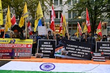 Demonstrators holding flags and signs protest outside India's consulate, a week after Canada's Prime Minister Justin Trudeau raised the prospect of New Delhi's involvement in the murder of Sikh separatist leader Hardeep Singh Nijjar, in Vancouver, British Columbia, Canada September 25, 2023. 