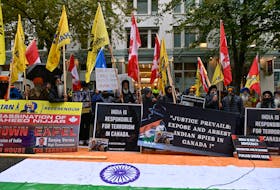 Demonstrators holding flags and signs protest outside India's consulate, a week after Canada's Prime Minister Justin Trudeau raised the prospect of New Delhi's involvement in the murder of Sikh separatist leader Hardeep Singh Nijjar, in Vancouver, British Columbia, Canada September 25, 2023. 